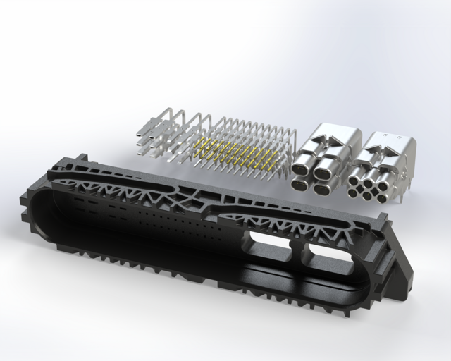 Auf dem Bild sind verschiedene technische Bauteile, einschließlich einer schwarzen Struktur und silberner Komponenten, abgebildet, die wahrscheinlich zu einem mechanischen oder elektronischen System gehören.